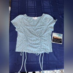 Blue floral blouse made by Outlaw. Size Medium. Selling for $20!!!